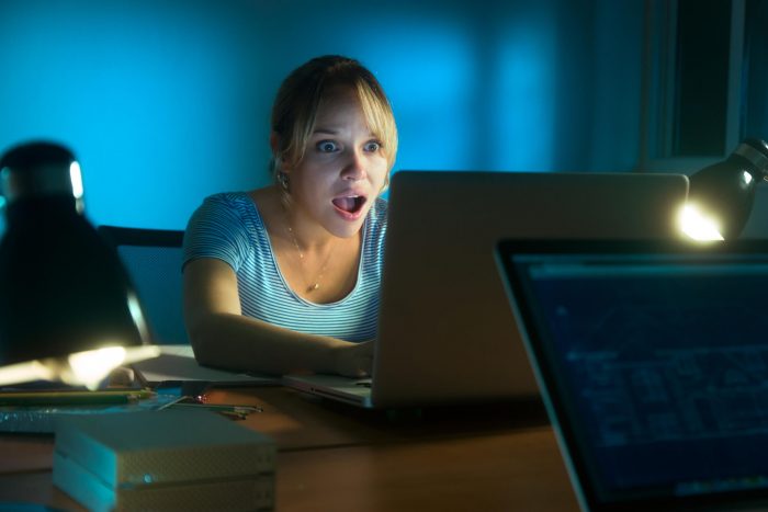 Woman Watching Shocking Message On Social Network