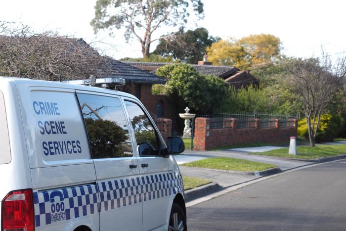 Police crime scene services van in an suburban area