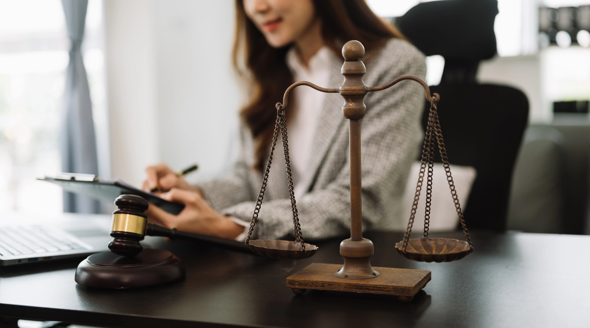 Justice and law concept.Female judge in a courtroom the gavel